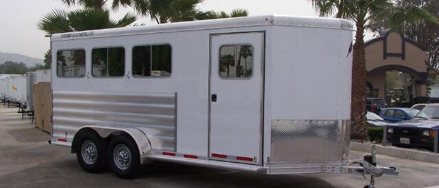 White Featherlite aluminum horse trailer