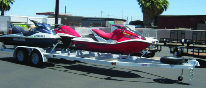 Playcraft utility trailer hauling multiple jet skis