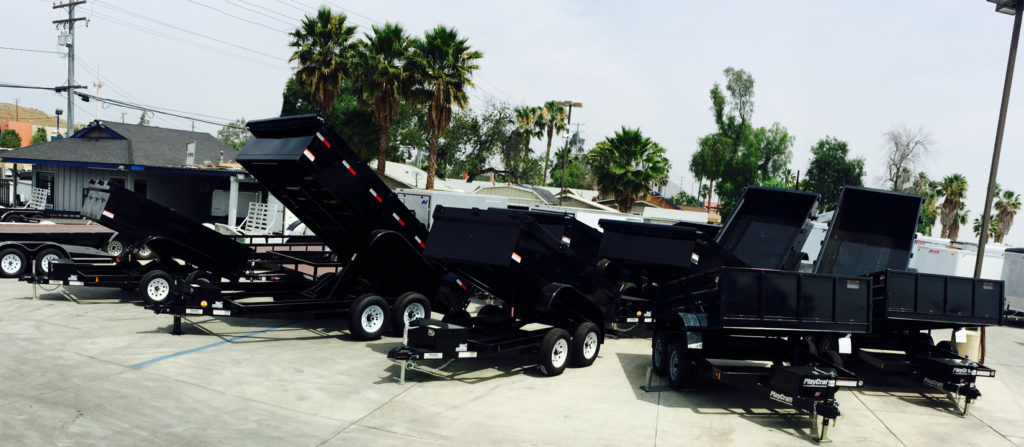 Multiple Innovative dump trailers in Norco Trailers parking lot