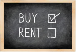 Chalkboard with Rent or Buy written on it and a checkmark next to Buy