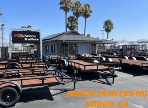 Text says Norco Trailers HQ Norco CA. Norco Trailers Norco CA Store entrance showing utility trailers and flatbed trailers